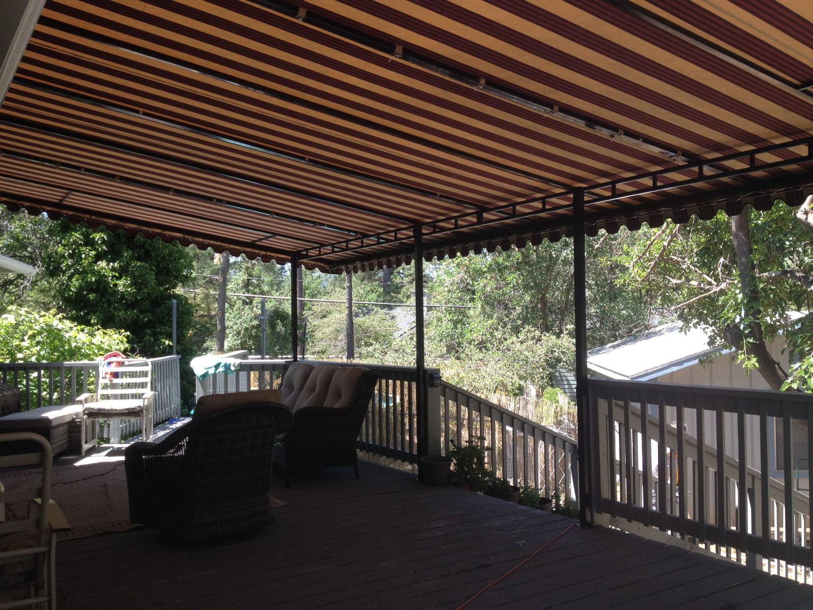 View from under a custom striped-fabric patio canopy on a welded steel frame, built by A Shade Beyond